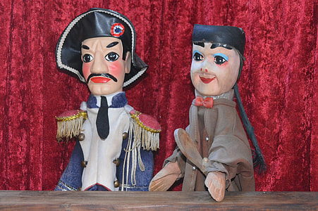male and female figurine on theater stage thumbnail