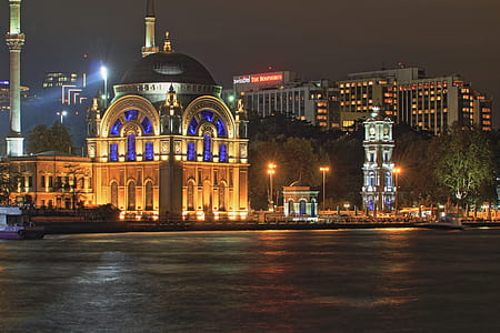 gray and black concrete dome building at night thumbnail