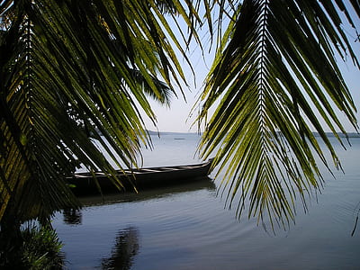 black boat on body of water during daytime thumbnail