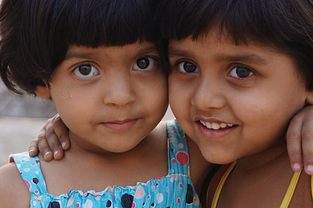 Girl in blue dress beside a Girl in yellow clothe thumbnail