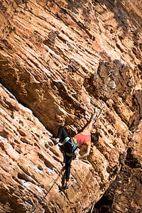 person climbing cliff thumbnail