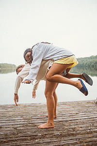 man carrying woman on his back thumbnail