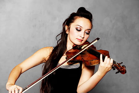 woman wearing black tank top playing violin thumbnail