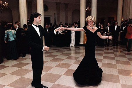 man and woman about to dance inside brown and white room thumbnail