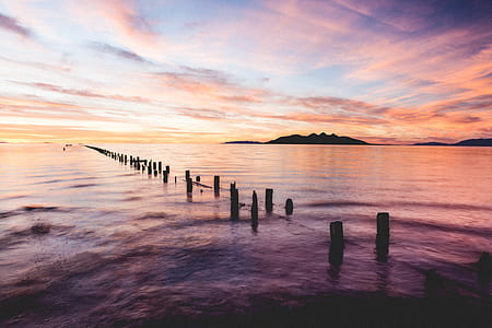 photo of dock covered with ocean thumbnail