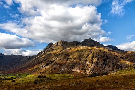 Landscape shot of a sunlit mountains in the Lake District, Cumbria England thumbnail