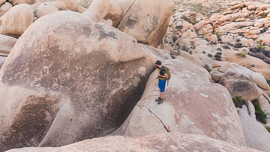 man standing on rock thumbnail