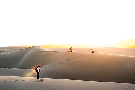 three person walking on desert thumbnail