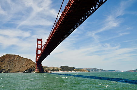 red metal bridge during daytime thumbnail