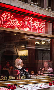 two women sitting inside of restaurant thumbnail