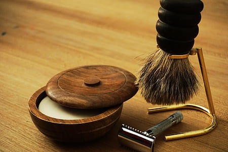 photo of brush with brown container beside shaver thumbnail