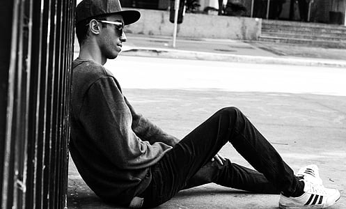 man sitting on surface thumbnail