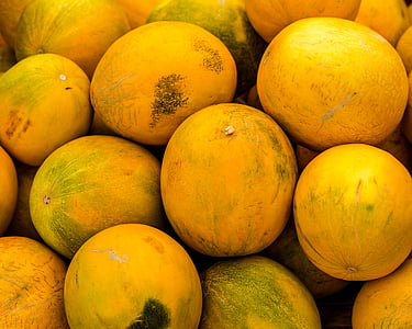 round yellow and green fruits in close-up photography thumbnail