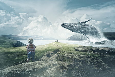 boy standing near sea with blue whale thumbnail