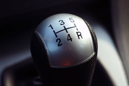 closeup photography black and gray vehicle gear shift lever thumbnail