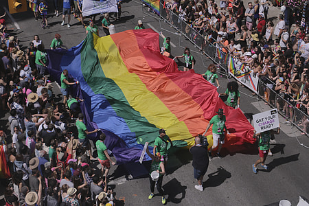 people holding multicolored textile thumbnail