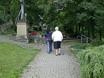 two women walking on park thumbnail