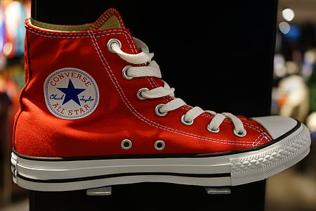 selective focused photo of a red and white Converse All-Star high-top sneaker thumbnail