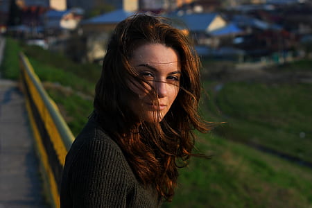 woman wearing black sweater with brown hair thumbnail