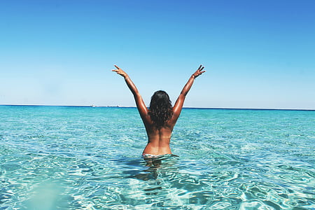 woman on body of water photography at daytime thumbnail