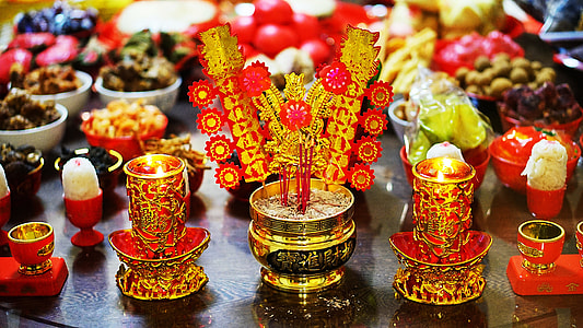 incense sticks in brass-colored jar thumbnail