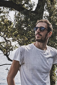 Man Wearing White Crew-neck T-shirt And Sunglasses thumbnail