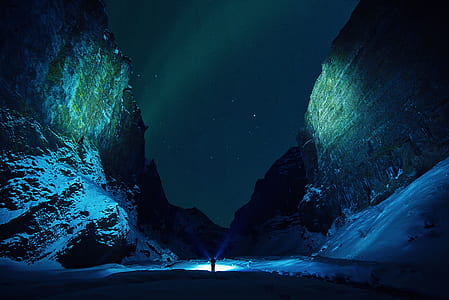 person between mountains thumbnail