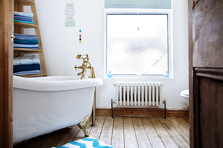 bathtub beside radiator heater thumbnail
