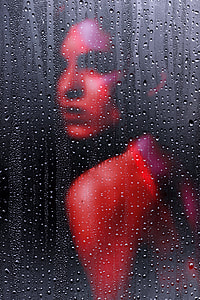 woman behind glass with water drops thumbnail