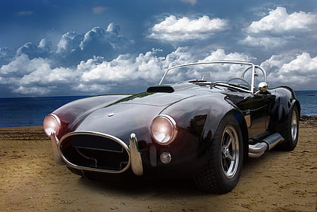 black convertible car under the cloudy sky thumbnail