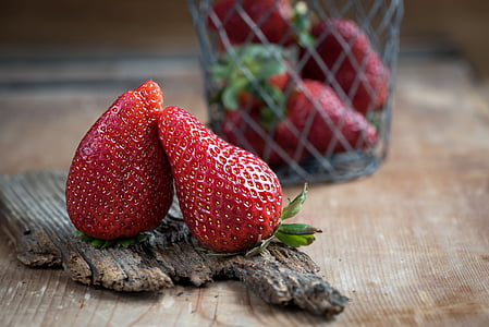 two red strawberries on brown surface thumbnail