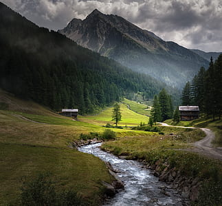 stream with background of mountains during golden hour thumbnail