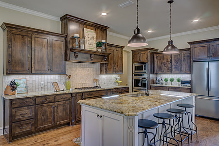 photo of brown marble top kitchen island with white wooden base thumbnail