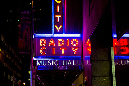 minimalist photography of Radio City music hall neon light signage thumbnail