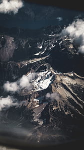person wearing goggles looking over mountains thumbnail