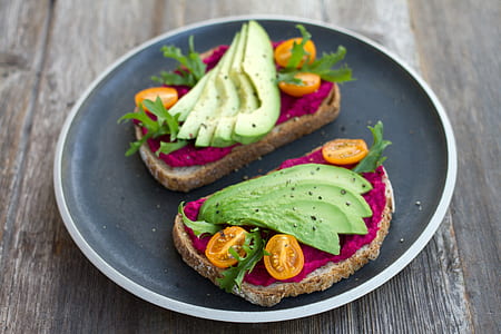 sliced veggies on toasted bread on plate thumbnail