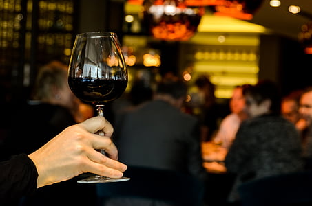 person holding wine glass thumbnail