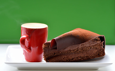 red ceramic cup on square ceramic plate thumbnail