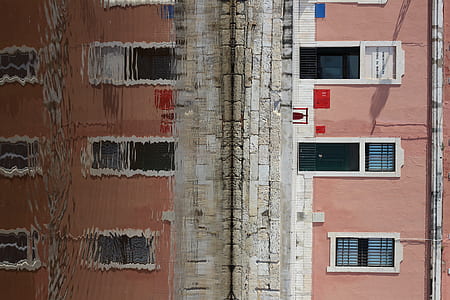 brown and white concrete building at daytime thumbnail