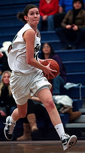 woman holding the basketball thumbnail