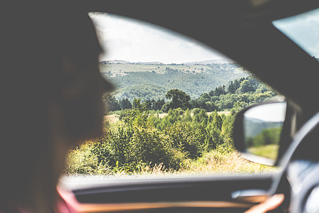 Man Driving a Car in Countryside thumbnail