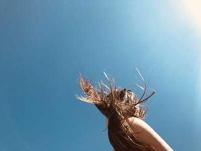 Woman Standing Under Blue Sky thumbnail