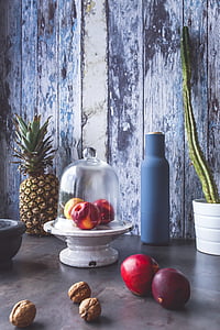 fruits and walnuts placed on beige shelf thumbnail