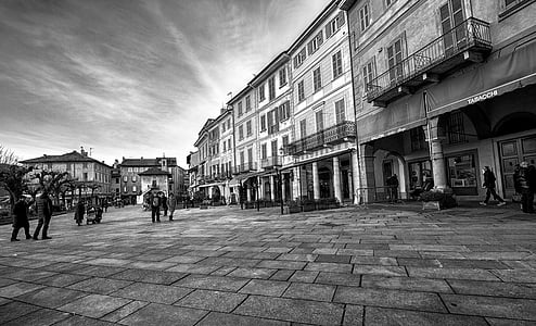 gray scale photography of group of people near building thumbnail