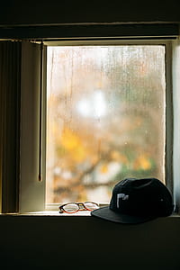 black cap near eyeglasses thumbnail