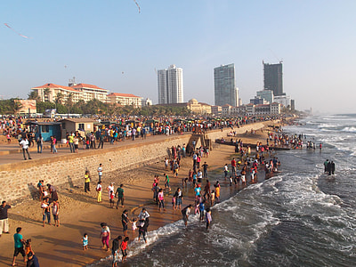 people on shore near buildings during daytime thumbnail
