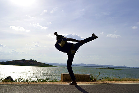 silhouette photo of man near water during daytime thumbnail