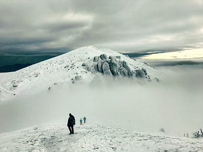 person standing on snow covered mountain thumbnail