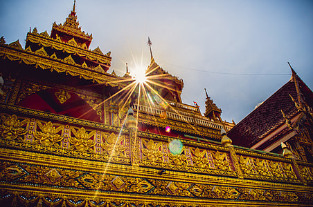 gold temple under blue sky during daytime thumbnail