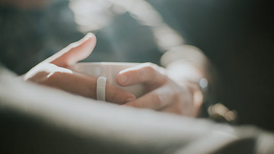 human hand in selective focus photography thumbnail